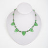 Elegant 1920s Art Deco molded and etched glass necklace, in a pretty peridot color.