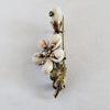 Circa 1860 Early Victorian Cowrie Shell Green and Yellow Gold-Filled Flower Brooch