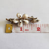 Circa 1860 Early Victorian Cowrie Shell Green and Yellow Gold-Filled Flower Brooch
