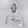 Circa 1910 18k White Gold Edwardian Filigree Ring with Diamonds and Emeralds